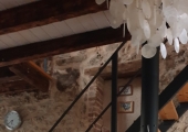 Erster Stock – Drehbarer Holzofen und Treppe